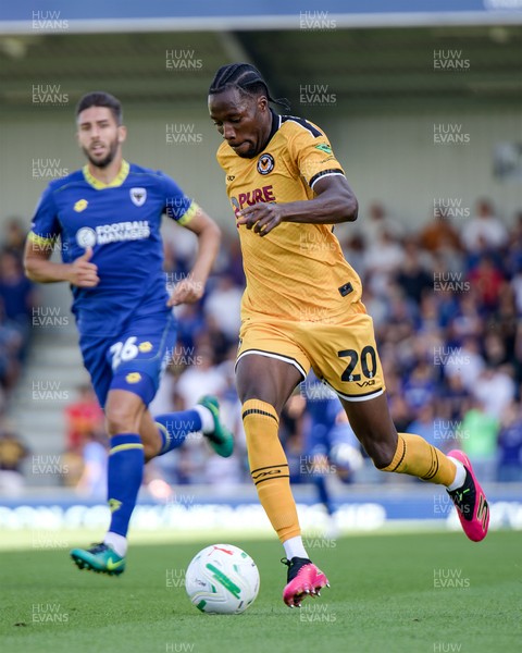 080826 - AFC Wimbledon v Newport County - Carabao Cup First Round - Yahya Bamba of Newport County in action