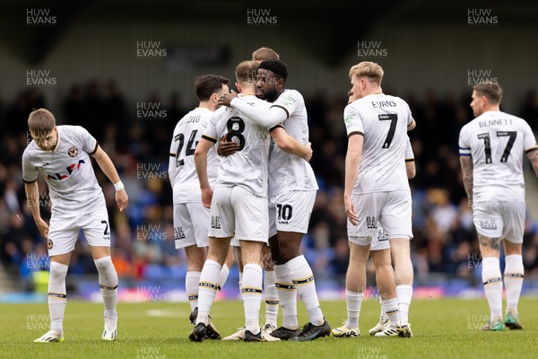 160324 - AFC Wimbledon v Newport County - Sky Bet League 2 - Bryn Morris of Newport County AFC celebrates with his teammates after scoring his side�s first goal