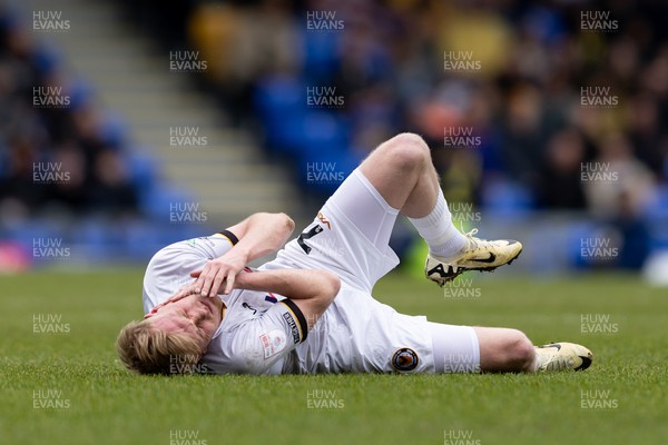 160324 - AFC Wimbledon v Newport County - Sky Bet League 2 - Will Evans of Newport County AFC lays on the floor injured