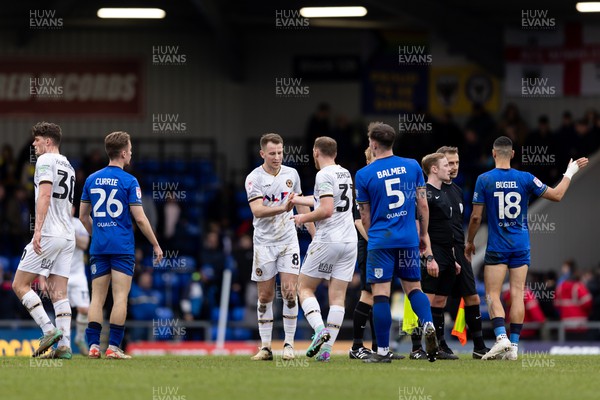 160324 - AFC Wimbledon v Newport County - Sky Bet League 2 - Bryn Morris of Newport County AFC and Luke Jephcott of Newport County AFC greet each other after the final whistle