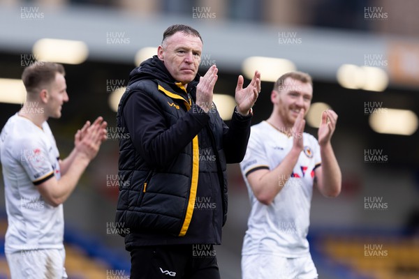 160324 - AFC Wimbledon v Newport County - Sky Bet League 2 - Graham Coughlan manager of Newport County AFC applauds the fans after their sides victory