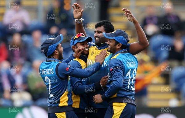 040619 - Afghanistan v Sri Lanka - ICC Cricket World Cup 2019 - Thisara Perera of Sri Lanka celebrates bowling out Mohammad Nabi with team mates