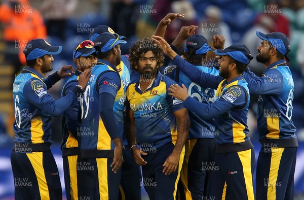 040619 - Afghanistan v Sri Lanka - ICC Cricket World Cup 2019 - Lasith Malinga of Sri Lanka celebrates taking the wicket of Hamid Hassan to win the game with team mates