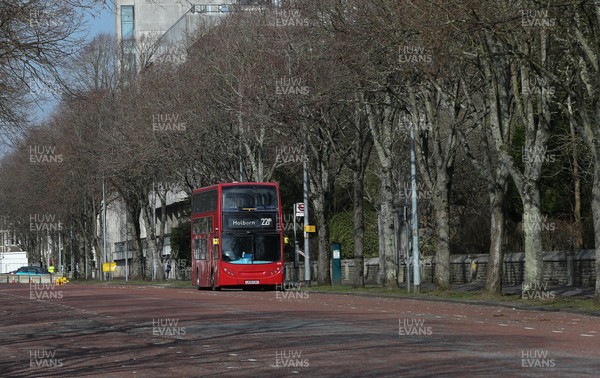 080321 - Alex Rider Filming, Cardiff - A London bus on deserted Cardiff streets, during filming of the second series of the Amazon Prime series Alex Rider in Cardiff