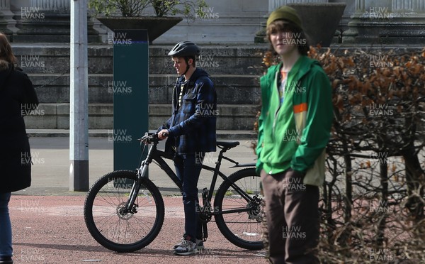 080321 - Alex Rider Filming, Cardiff - Actor Otto Farrant, who plays the title role in Alex Rider, on his bike along with co-star Brenock O'Connor who plays Tom Harris, during filming of the second series of the Amazon Prime series in Cardiff