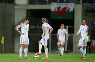 090914 - Andorra v Wales - 2016 Euro Qualifier -Gareth Bale, Simon Church and Aaron Ramsey of Wales look dejected following Ildefons Lima goal