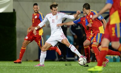 090914 - Andorra v Wales - 2016 Euro Qualifier -Gareth Bale of Wales is tackled by Josep Ayala of Andorra