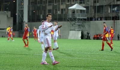090914 - Andorra v Wales - 2016 Euro Qualifier -Gareth Bale of Wales calms his teams fans following his second goal