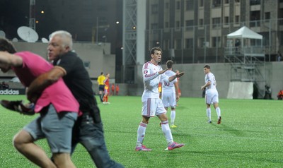 090914 - Andorra v Wales - 2016 Euro Qualifier -Gareth Bale of Wales calms his teams fans following his second goal