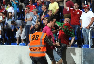 090914 - Andorra v Wales - 2016 Euro Qualifier -Wales fans invade the pitch following Gareth Bale second goal