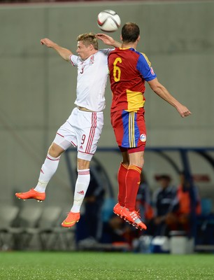 090914 - Andorra v Wales - 2016 Euro Qualifier -Simon Church of Wales and JIldefons Lima of Andorra compete