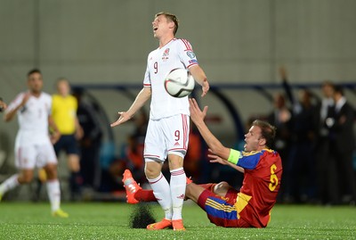 090914 - Andorra v Wales - 2016 Euro Qualifier -Simon Church of Wales reacts as JIldefons Lima of Andorra appeals