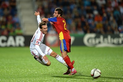 090914 - Andorra v Wales - 2016 Euro Qualifier -Aaron Ramsey of Wales is tackled by Christian Martinez of Andorra