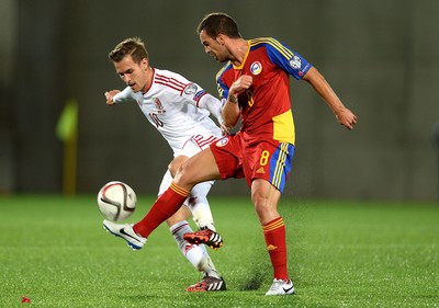 090914 - Andorra v Wales - 2016 Euro Qualifier -Aaron Ramsey of Wales is tackled by Marcio Vieira of Andorra