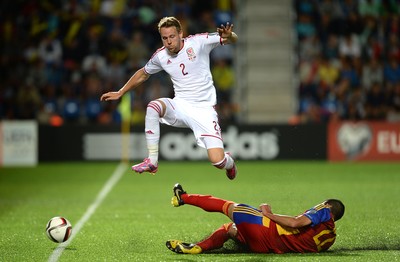 090914 - Andorra v Wales - 2016 Euro Qualifier -Chris Gunter of Wales is tackled by David Maneiro of Andorra