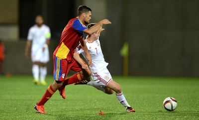 090914 - Andorra v Wales - 2016 Euro Qualifier -Joe Allen of Wales is tackled by Marc Vales of Andorra