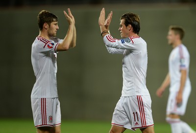 090914 - Andorra v Wales - 2016 Euro Qualifier -Gareth Bale of Wales celebrates win with Ben Davies