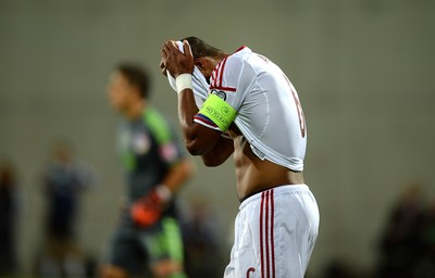 090914 - Andorra v Wales - 2016 Euro Qualifier -Ashley Williams of Wales looks dejected