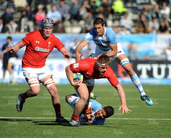 040619 - Argentina U20 v Wales U20 - World Rugby Under 20 Championship -  Kemsley Mathias of Wales is tackled by Santiango Chocobares