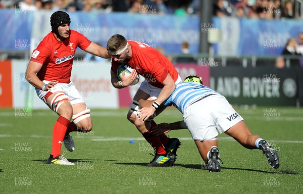 040619 - Argentina U20 v Wales U20 - World Rugby Under 20 Championship -  Jac Price of Wales is tackled by Franscico Coria