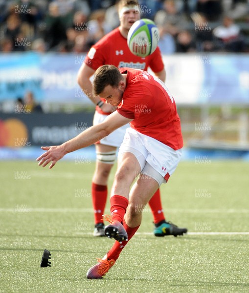 040619 - Argentina U20 v Wales U20 - World Rugby Under 20 Championship -  Cai Evans of Wales kicks for goal