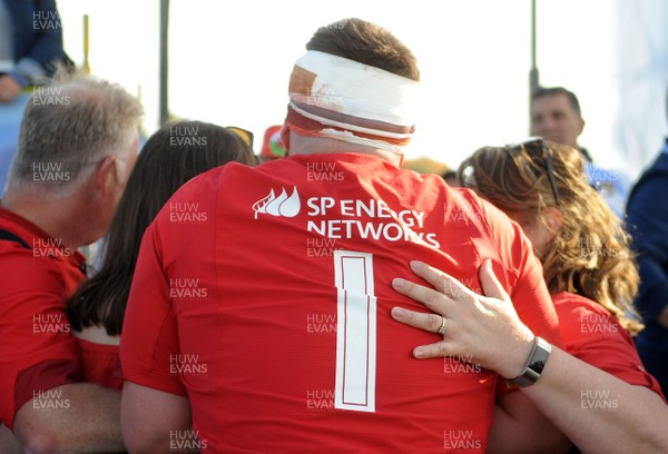 040619 - Argentina U20 v Wales U20 - World Rugby Under 20 Championship -  Kemsley Mathias of Wales U20 gets hug from his family at the end of the match