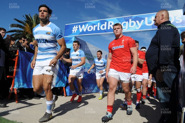 040619 - Argentina U20 v Wales U20 - World Rugby Under 20 Championship -  Dewi Lake of Wales and Juan Pablo Castro of Argentina lead their teams out for the start of the match