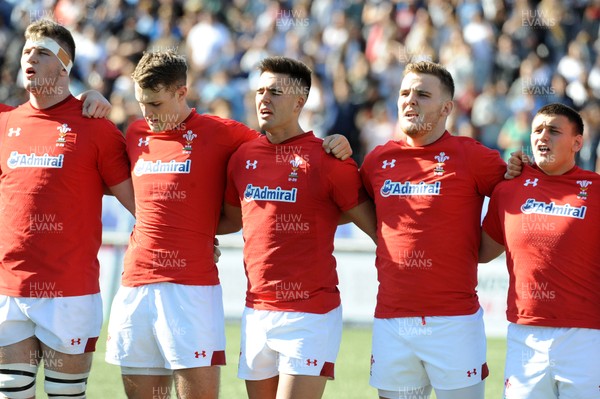 040619 - Argentina U20 v Wales U20 - World Rugby Under 20 Championship -  (L to R) Teddy Williams, Max Llewellyn, Tiaan Thomas-Wheeler and Will Griffiths sing the national anthem
