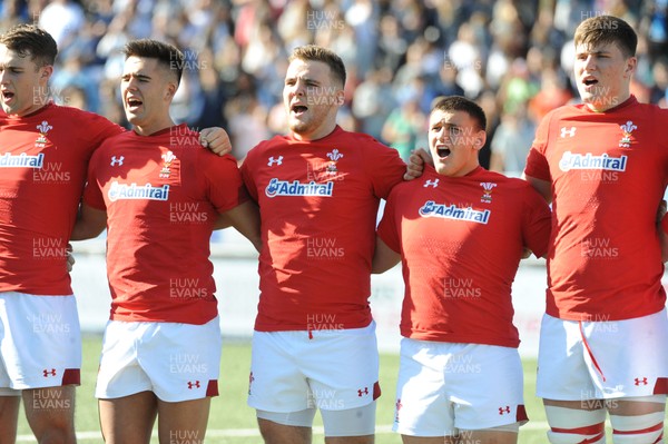 040619 - Argentina U20 v Wales U20 - World Rugby Under 20 Championship -  (L to R) Max Llewellyn, Tiaan Thomas-Wheeler, Will Griffiths and Ed Scragg sing the national anthem