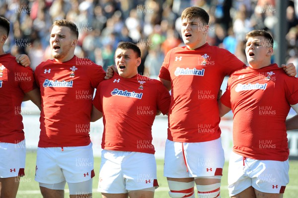 040619 - Argentina U20 v Wales U20 - World Rugby Under 20 Championship -  (L to R) Tiaan Thomas-Wheeler, Will Griffiths, Ed Scragg and Nick English sing the national anthem