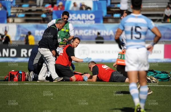040619 - Argentina U20 v Wales U20 - World Rugby Under 20 Championship -  Aneurin Owen of Wales receives treatment from the medics before leaving the field injured