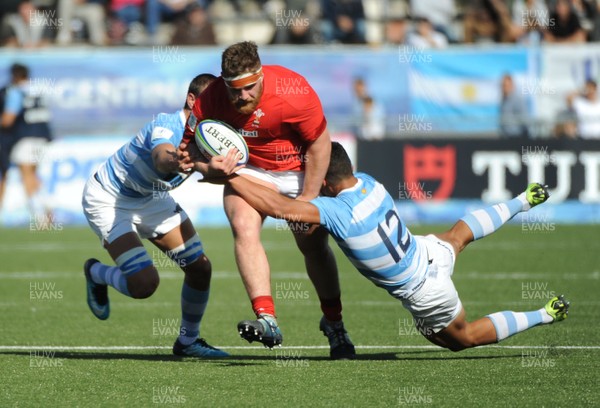 040619 - Argentina U20 v Wales U20 - World Rugby Under 20 Championship -  Kemsley Mathias of Wales is tackled by Santiango Chocobares (12)