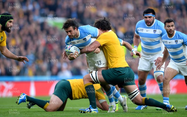 251015 - Argentina v Australia - Rugby World Cup Semi Final 2015 -Marcelo Bosch of Argentina is tackled by James Slipper and Kane Douglas of Australia