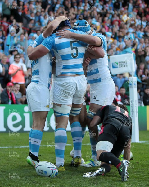 250915 - Argentina v Georgia - Rugby World Cup - Tomas Lavanini of Argentina celebrates with team mates after scoring a try