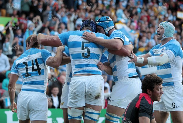 250915 - Argentina v Georgia - Rugby World Cup - Tomas Lavanini of Argentina celebrates with team mates after scoring a try