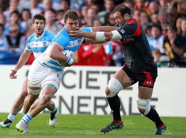 250915 - Argentina v Georgia - Rugby World Cup - Facundo Isa of Argentina is tackled by Mamuka Gorgodze of Georgia