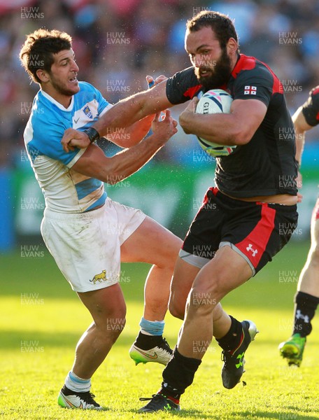 250915 - Argentina v Georgia - Rugby World Cup - Tamaz Mchedlidze of Georgia smashes past Tomas Cubelli of Argentina