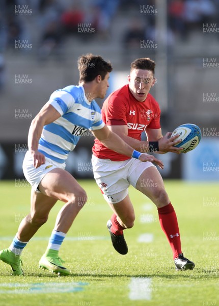 090618 - Argentina v Wales - International Rugby Union - Josh Adams of Wales takes on Bautista Delguy of Argentina