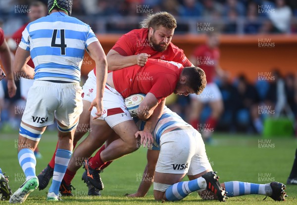 090618 - Argentina v Wales - International Rugby Union - Rob Evans of Wales is tackled by Marcos Kremer of Argentina