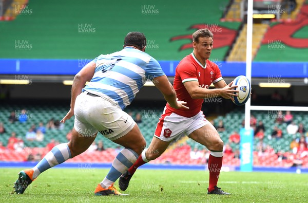 100721 - Argentina v Wales - International Rugby - Jarrod Evans of Wales takes on Francisco Gomez Kodela of Argentina