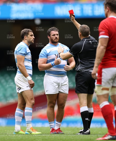 100721 - Argentina v Wales - Summer International Series - Juan Cruz Mallia of Argentina is given a red card by Referee Matthew Carley