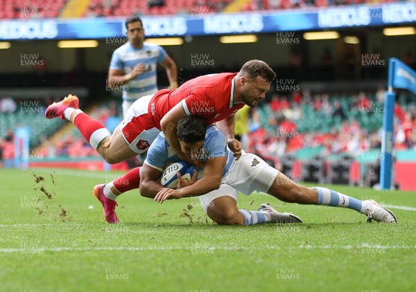 100721 - Argentina v Wales, Summer International First Test - Owen Lane of Wales puts Santiago Carreras of Argentina under pressure as they compete for the ball