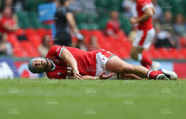 100721 - Argentina v Wales, Summer International First Test - Jonathan Davies of Wales reacts after taking a knock