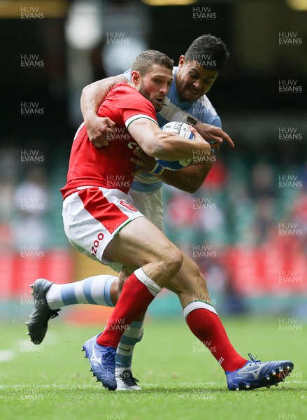 100721 - Argentina v Wales, Summer International First Test - Jonah Holmes of Wales is tackled by Santiago Chocobares of Argentina