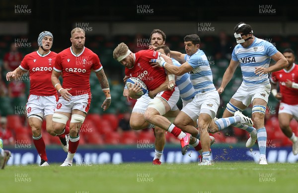 100721 - Argentina v Wales, Summer International First Test - Aaron Wainwright of Wales is tackled by Tomas Cubelli of Argentina and Nicolas Sanchez of Argentina 
