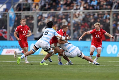 110726 - Argentina v Wales - Nations Championship - Joe Hawkins of Wales is tackled by Santiago Grondona and Joaquin Oviedo of Argentina 