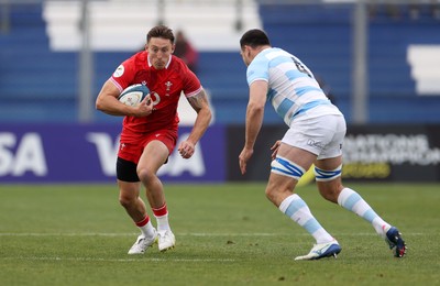 110726 - Argentina v Wales - Nations Championship - Josh Adams of Wales is challenged by Guido Petti of Argentina 