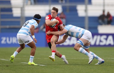 110726 - Argentina v Wales - Nations Championship - Josh Adams of Wales is tackled by Guido Petti of Argentina 
