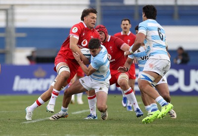 110726 - Argentina v Wales - Nations Championship - Bautista Delguy of Argentina is tackled by Teddy Williams of Wales 