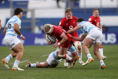 110726 - Argentina v Wales - Nations Championship - Aaron Wainwright of Wales is tackled by Simon Benitez Cruz of Argentina 